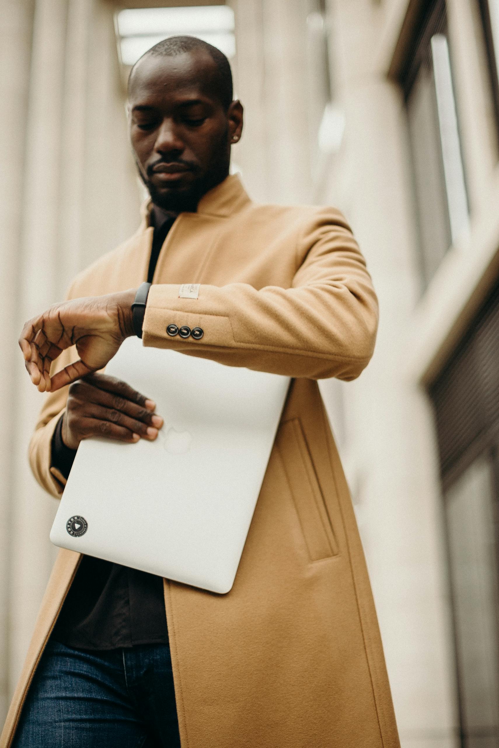 Man in Brown Overcoat Looking At The Time