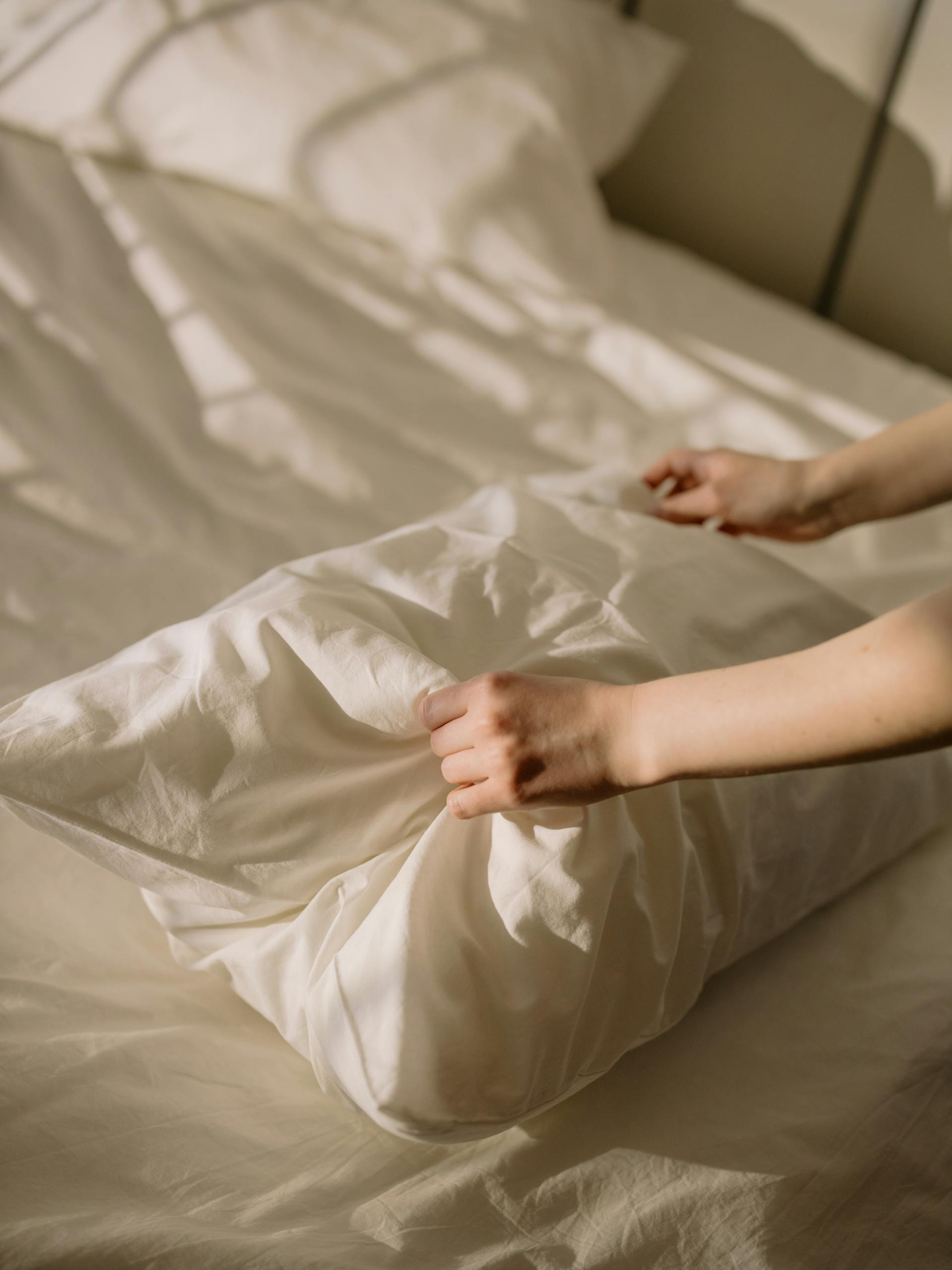 Person Lying on White Bed